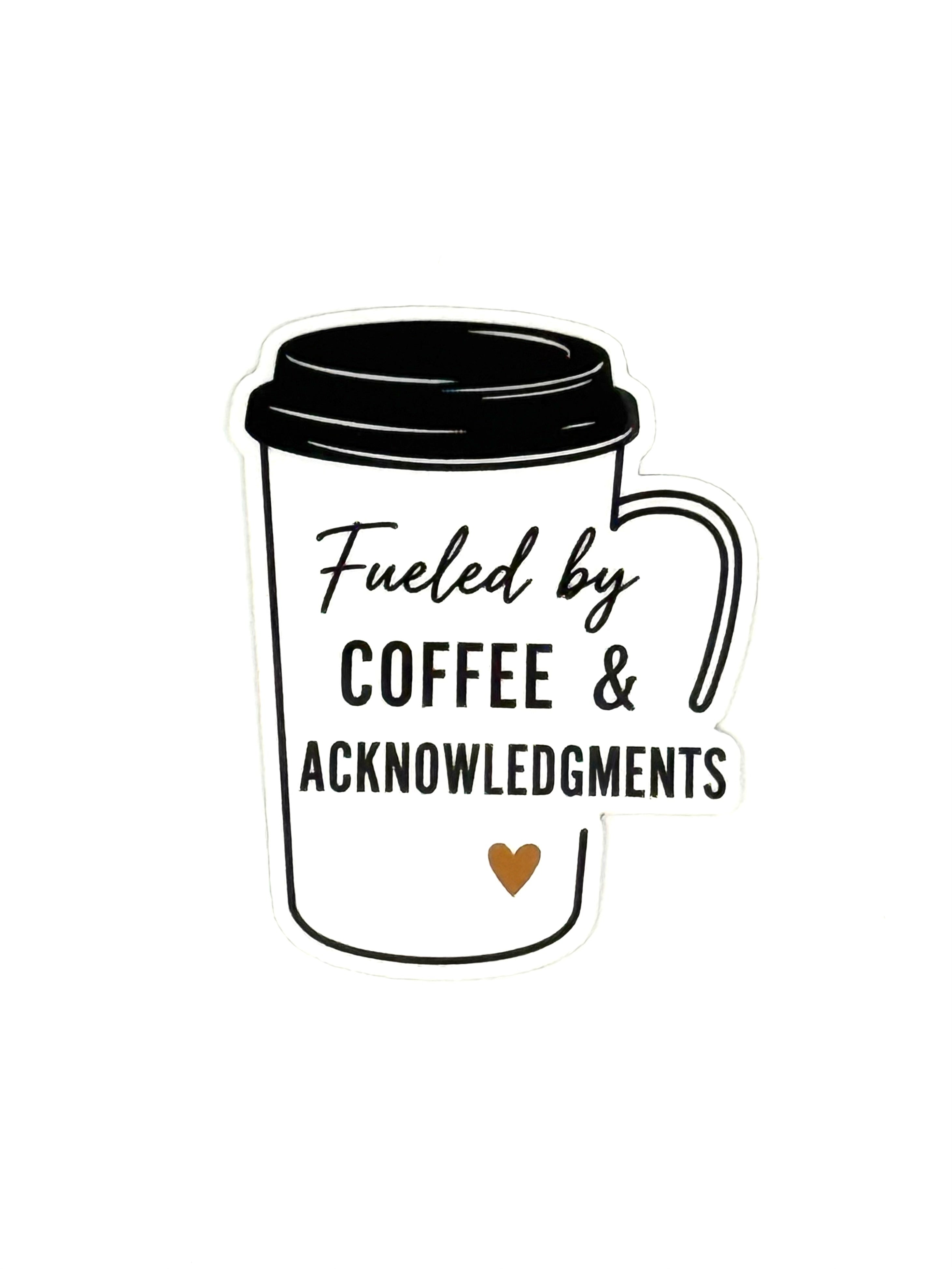 White coffee cup with black lid and text 'Fueled by Coffee & Acknowledgements' on a white background