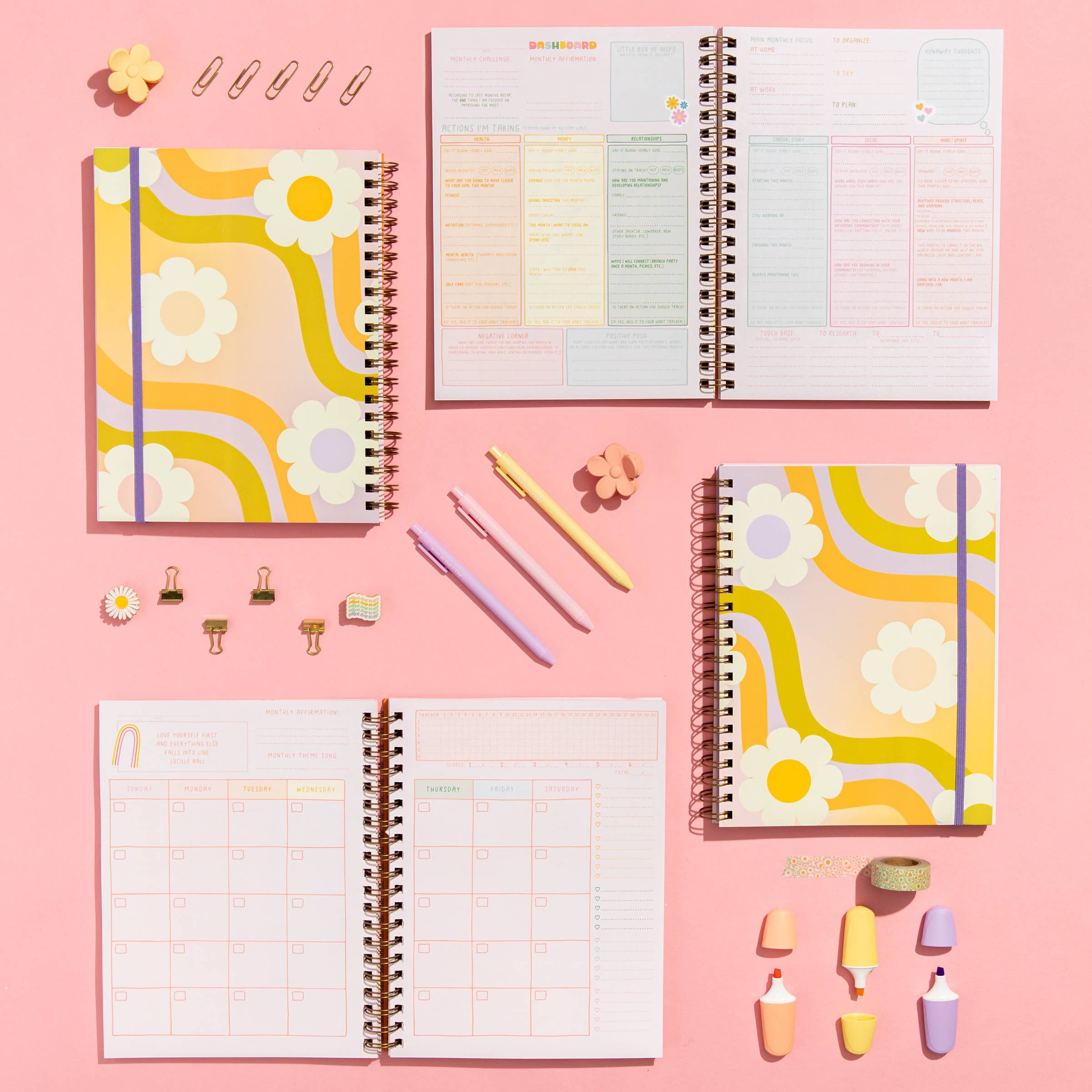 Planners with colorful designs on a pink background